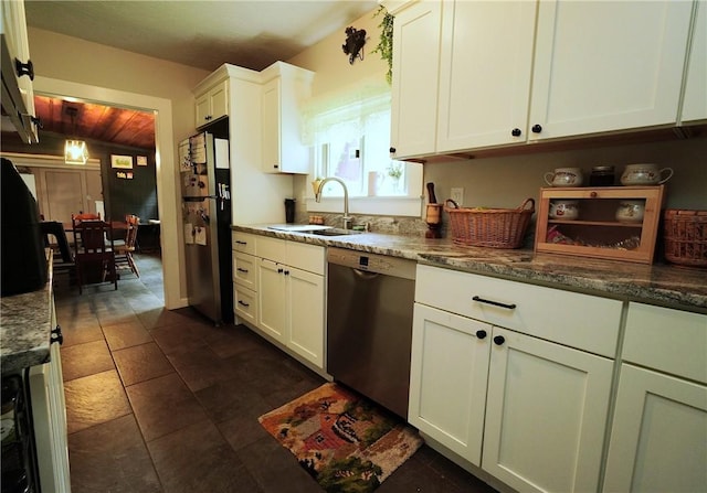 318 Saint Paul St, North Smithfield, RI 02896 - kitchen featuring appliances with stainless steel finishes, white cabinetry, dark stone counters, and dark tile patterned floors