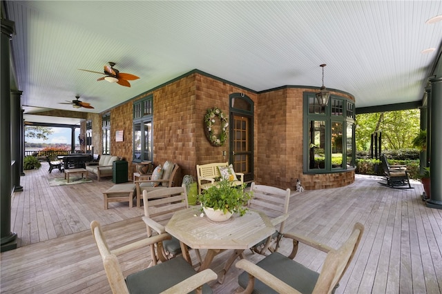 17 Pojac Point Rd, North Kingstown, RI 02852 - porch with ceiling fan and outdoor dining area