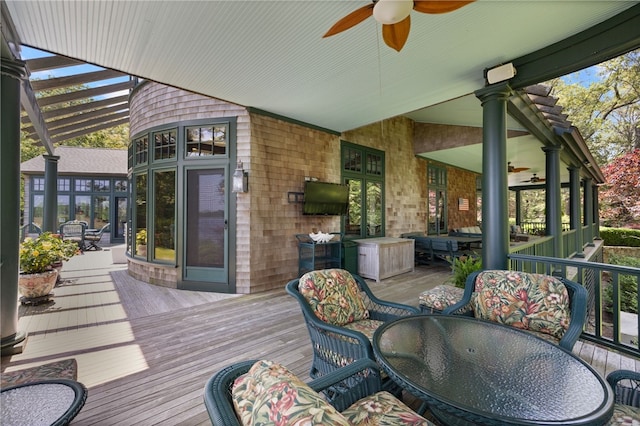 17 Pojac Point Rd, North Kingstown, RI 02852 - deck with outdoor dining area and ceiling fan