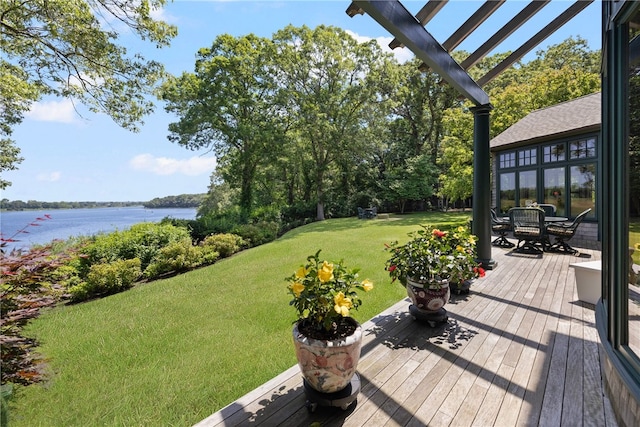 17 Pojac Point Rd, North Kingstown, RI 02852 - wooden terrace with a water view, a lawn, and outdoor dining area