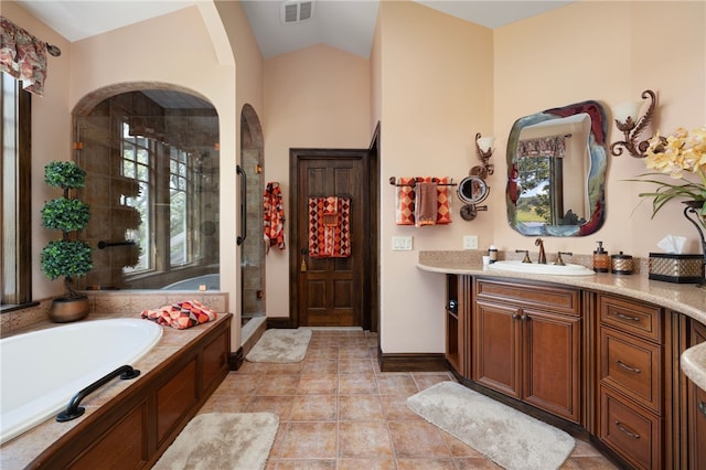 17 Pojac Point Rd, North Kingstown, RI 02852 - full bath with a shower stall, vanity, a garden tub, tile patterned floors, and vaulted ceiling