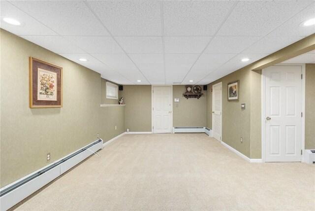 25 Rosewood Dr, North Providence, RI 02904 - finished basement featuring baseboard heating, light carpet, a paneled ceiling, and recessed lighting