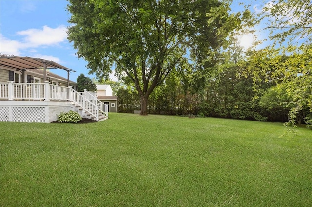 25 Rosewood Dr, North Providence, RI 02904 - view of grassy yard featuring a wooden deck and stairs