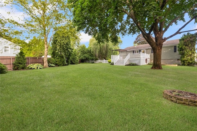 25 Rosewood Dr, North Providence, RI 02904 - view of yard featuring a wooden deck and stairs