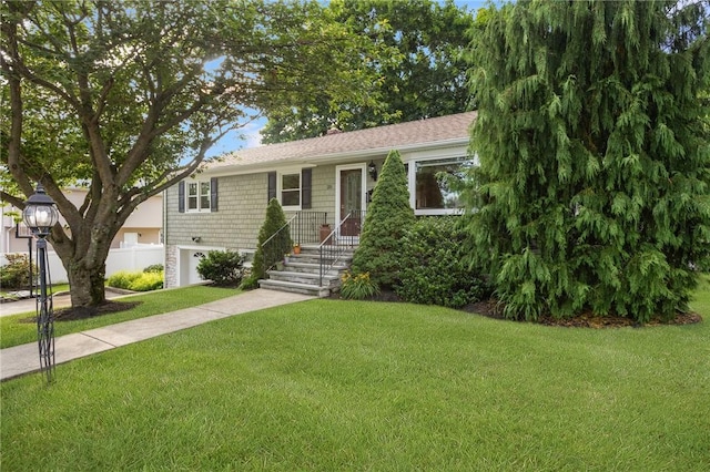 25 Rosewood Dr, North Providence, RI 02904 - view of front of house with a front lawn, an attached garage, and concrete driveway