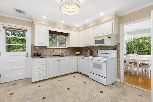 25 Rosewood Dr, North Providence, RI 02904 - kitchen featuring white appliances, a chandelier, dark countertops, white cabinetry, and crown molding
