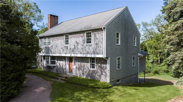 61 Bay View Rd, Charlestown, RI 02813 - view of side of home featuring a chimney, a lawn, and a shingled roof