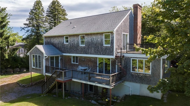 61 Bay View Rd, Charlestown, RI 02813 - rear view of house with stairs, a chimney, a sunroom, and a yard