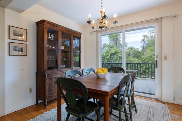 61 Bay View Rd, Charlestown, RI 02813 - dining space with a chandelier and light wood-style flooring