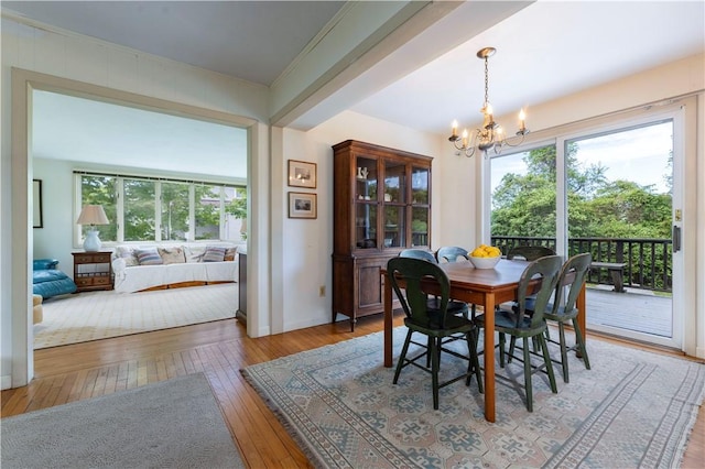 61 Bay View Rd, Charlestown, RI 02813 - dining room with a chandelier, hardwood / wood-style flooring, and plenty of natural light