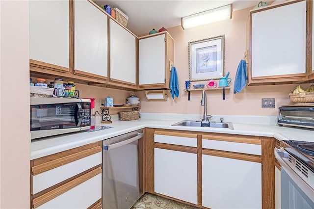 66 Girard Ave Unit 322, Newport, RI 02840 - kitchen featuring stainless steel appliances, light countertops, and white cabinets