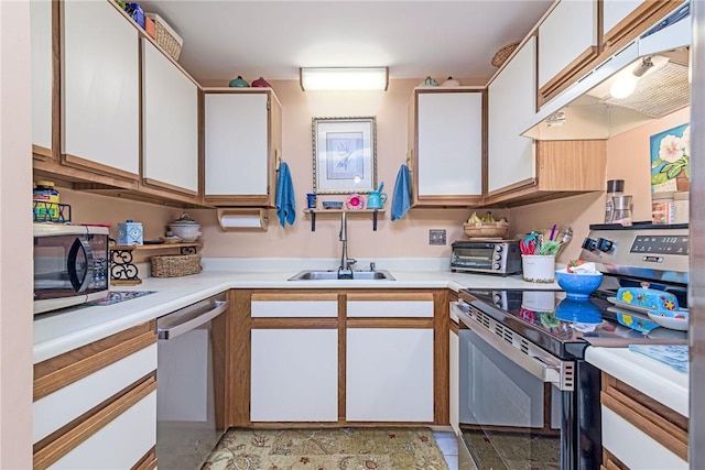 66 Girard Ave Unit 322, Newport, RI 02840 - kitchen featuring appliances with stainless steel finishes, white cabinets, light countertops, and under cabinet range hood
