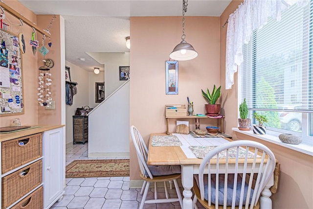 66 Girard Ave Unit 322, Newport, RI 02840 - dining room with light tile patterned floors and stairs