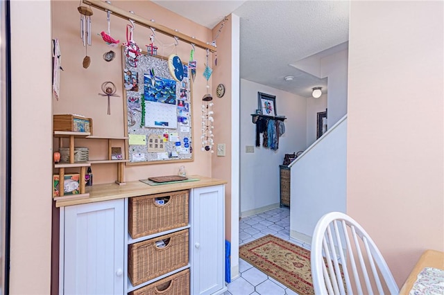66 Girard Ave Unit 322, Newport, RI 02840 - bar area with light tile patterned floors and stairs