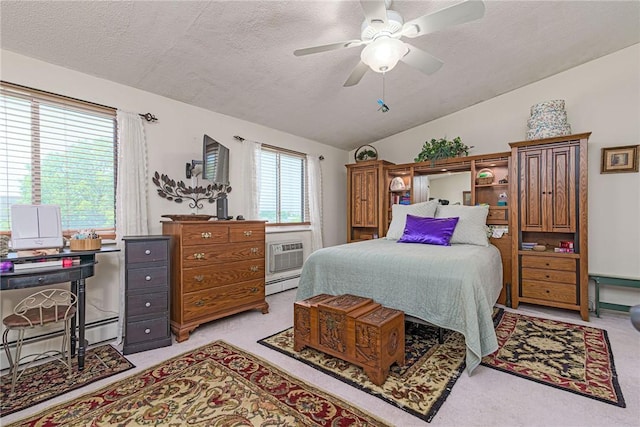 66 Girard Ave Unit 322, Newport, RI 02840 - bedroom featuring light carpet, lofted ceiling, a textured ceiling, a baseboard radiator, and an AC wall unit