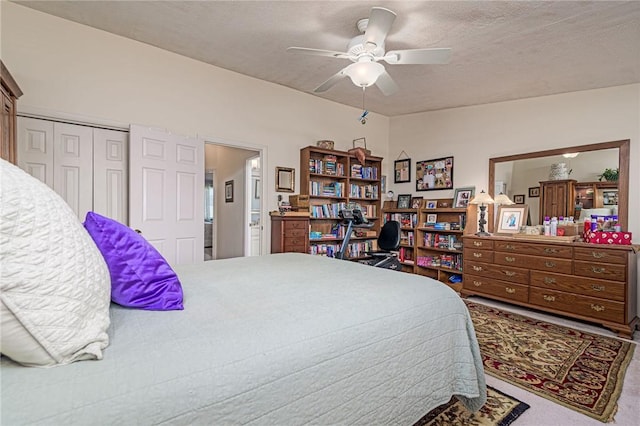 66 Girard Ave Unit 322, Newport, RI 02840 - carpeted bedroom featuring a textured ceiling, a closet, and a ceiling fan