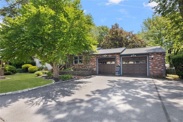 6 Lachance Ave, Warwick, RI 02889 - view of front facade with an attached garage, driveway, a front lawn, and brick siding