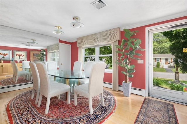 6 Lachance Ave, Warwick, RI 02889 - dining space featuring plenty of natural light, wood finished floors, and ornamental molding