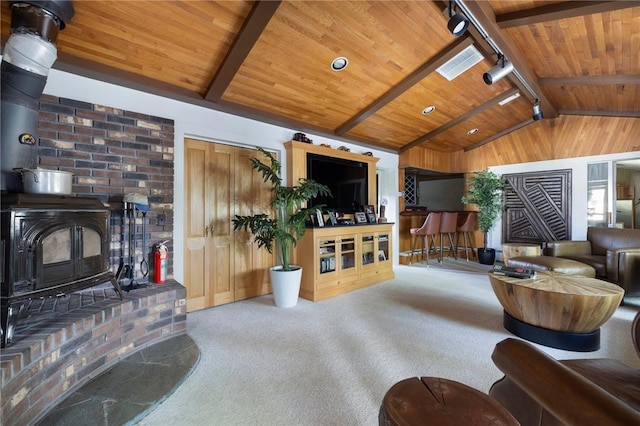 6 Lachance Ave, Warwick, RI 02889 - carpeted living area featuring wood ceiling, a wood stove, and rail lighting