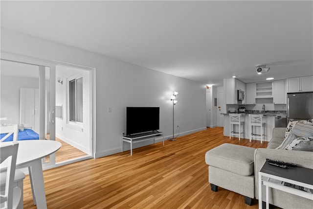 401 Bellevue Ave Unit 214, Newport, RI 02840 - living room featuring light wood-style floors and baseboards