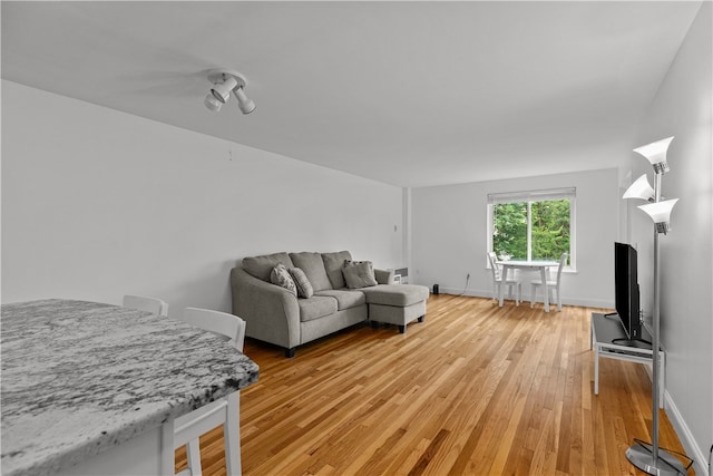 401 Bellevue Ave Unit 214, Newport, RI 02840 - living room with light wood-style flooring and baseboards