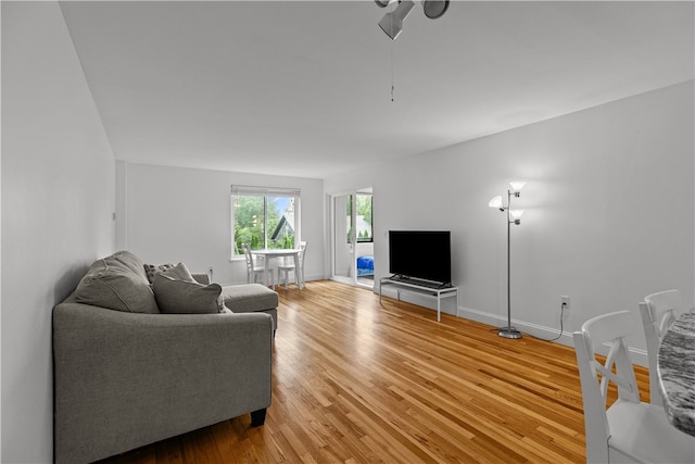 401 Bellevue Ave Unit 214, Newport, RI 02840 - living area with a ceiling fan and light wood-style flooring