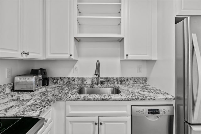 401 Bellevue Ave Unit 214, Newport, RI 02840 - kitchen with stainless steel appliances, white cabinets, and light stone countertops