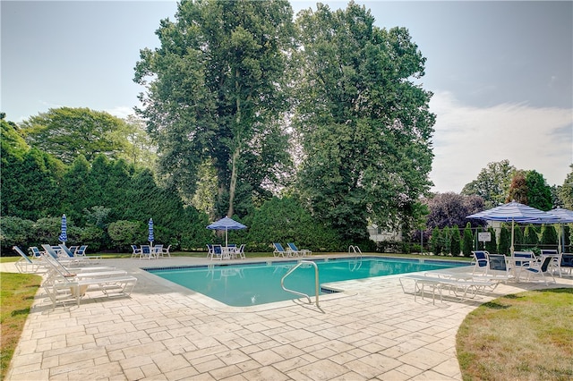 401 Bellevue Ave Unit 214, Newport, RI 02840 - community pool featuring a patio and view of wooded area