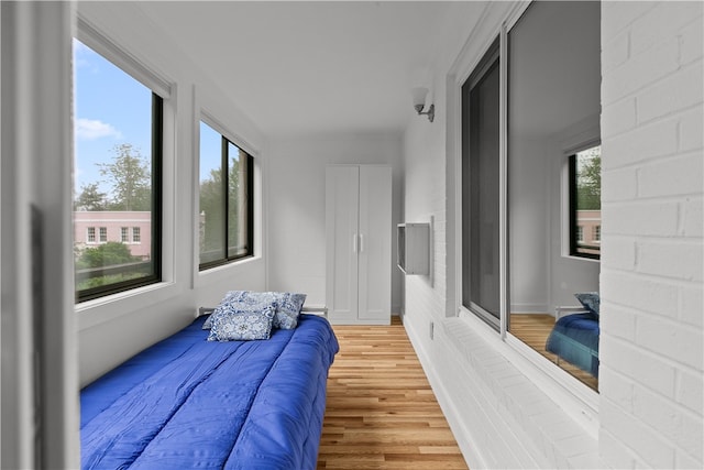 401 Bellevue Ave Unit 214, Newport, RI 02840 - bedroom featuring light wood-style flooring and multiple windows