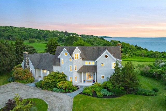 1003 Fort Getty Rd, Jamestown, RI 02835 - shingle-style home featuring a chimney, a lawn, and driveway