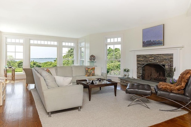 1003 Fort Getty Rd, Jamestown, RI 02835 - living room featuring wood finished floors and a stone fireplace