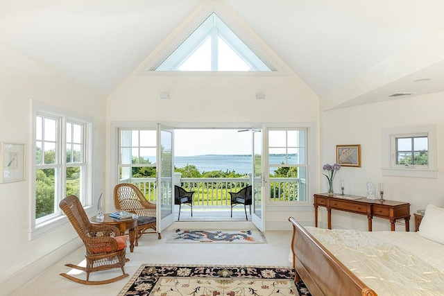 1003 Fort Getty Rd, Jamestown, RI 02835 - bedroom with access to outside, multiple windows, high vaulted ceiling, and a water view