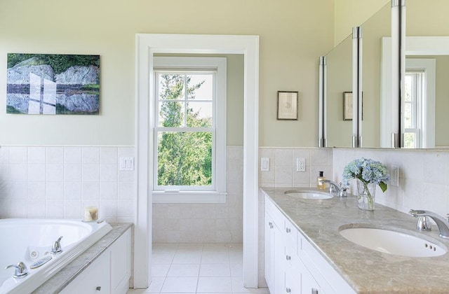 1003 Fort Getty Rd, Jamestown, RI 02835 - bathroom with tile walls, double vanity, plenty of natural light, a whirlpool tub, and tile patterned flooring