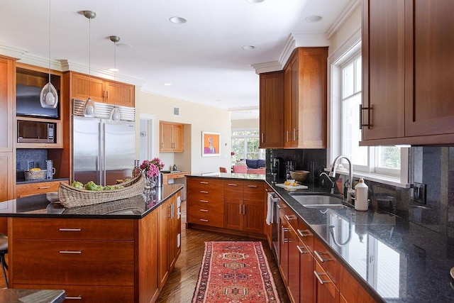 1003 Fort Getty Rd, Jamestown, RI 02835 - kitchen featuring built in appliances, dark wood-style floors, dark stone counters, brown cabinets, and recessed lighting
