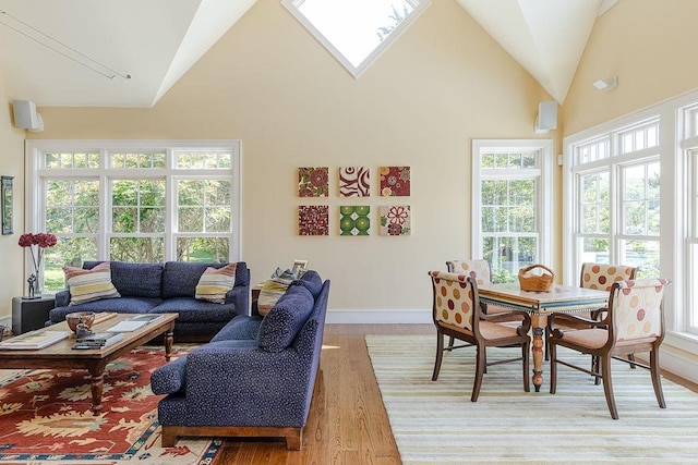 1003 Fort Getty Rd, Jamestown, RI 02835 - living room featuring vaulted ceiling, light wood-style floors, and plenty of natural light