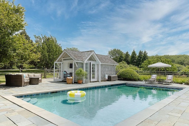 1003 Fort Getty Rd, Jamestown, RI 02835 - swimming pool featuring a patio area, a storage structure, an outbuilding, and an outdoor hangout area
