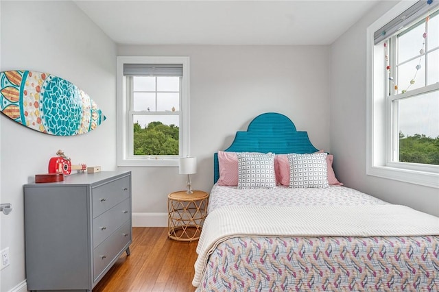 100 Algonquin Rd Unit 5, Narragansett, RI 02882 - bedroom featuring multiple windows and wood finished floors
