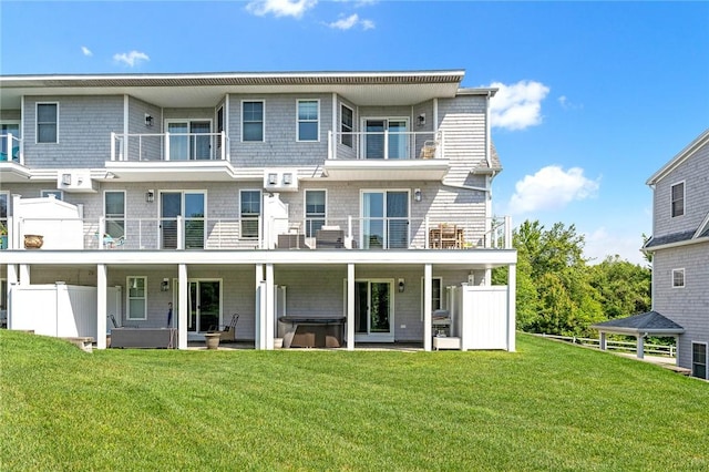 100 Algonquin Rd Unit 5, Narragansett, RI 02882 - back of house with a hot tub and a yard