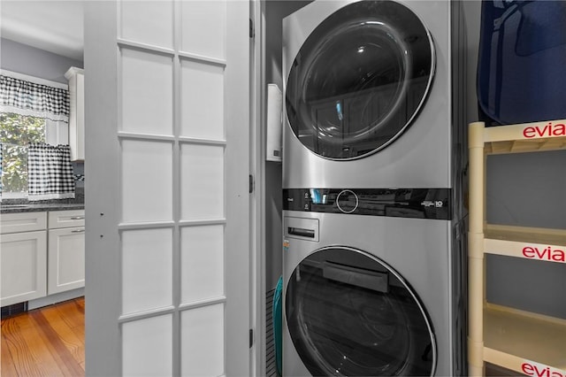 39 Owen Ave, Pawtucket, RI 02860 - laundry room with stacked washing machine and dryer and wood finished floors