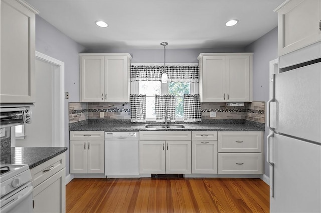 39 Owen Ave, Pawtucket, RI 02860 - kitchen featuring white appliances, white cabinets, decorative backsplash, wood finished floors, and recessed lighting