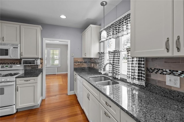 39 Owen Ave, Pawtucket, RI 02860 - kitchen with white appliances, light wood finished floors, decorative backsplash, white cabinetry, and recessed lighting