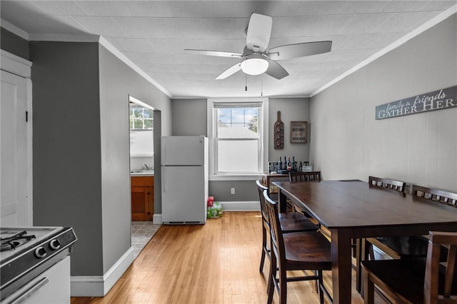 39 Owen Ave, Pawtucket, RI 02860 - dining area featuring ornamental molding, ceiling fan, and light wood-style flooring