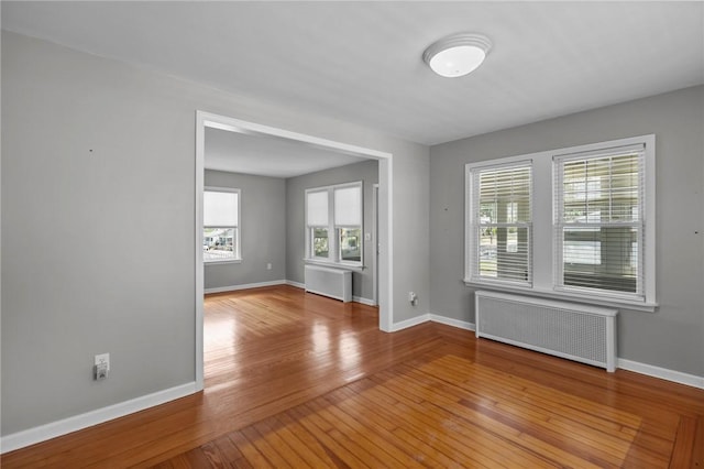 39 Owen Ave, Pawtucket, RI 02860 - empty room featuring radiator and hardwood / wood-style flooring