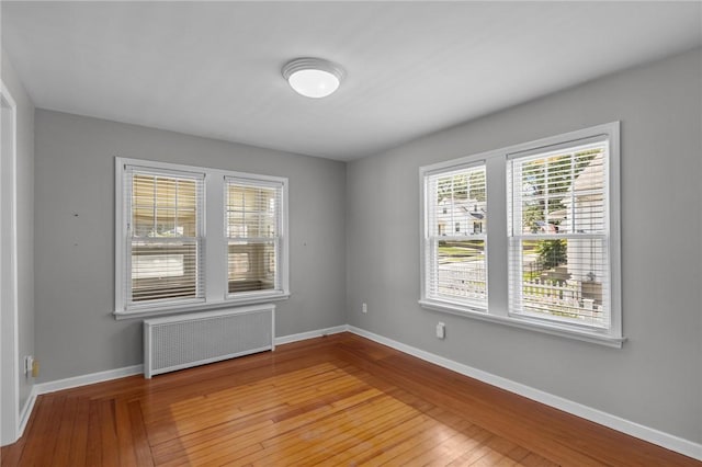 39 Owen Ave, Pawtucket, RI 02860 - spare room featuring radiator, healthy amount of natural light, and hardwood / wood-style floors