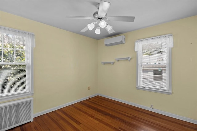 39 Owen Ave, Pawtucket, RI 02860 - spare room featuring radiator, a wall mounted air conditioner, wood finished floors, and plenty of natural light