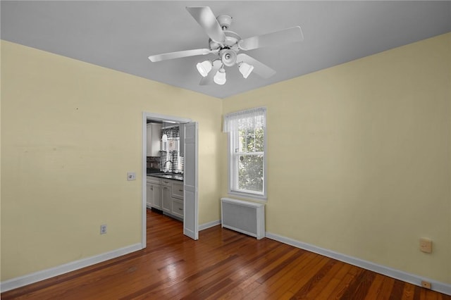 39 Owen Ave, Pawtucket, RI 02860 - unfurnished bedroom with radiator, dark wood finished floors, and a ceiling fan