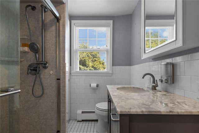 39 Owen Ave, Pawtucket, RI 02860 - bathroom featuring baseboard heating, vanity, a shower stall, tile patterned flooring, and plenty of natural light