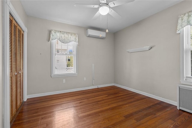 39 Owen Ave, Pawtucket, RI 02860 - unfurnished bedroom with a closet, wood-type flooring, radiator, and an AC wall unit