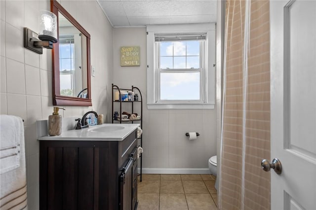 39 Owen Ave, Pawtucket, RI 02860 - bathroom with tile walls, vanity, and tile patterned flooring