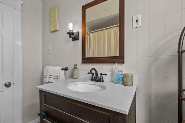 39 Owen Ave, Pawtucket, RI 02860 - full bathroom featuring tile walls, vanity, and backsplash
